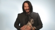 Keanu Reeves Plays With Puppies